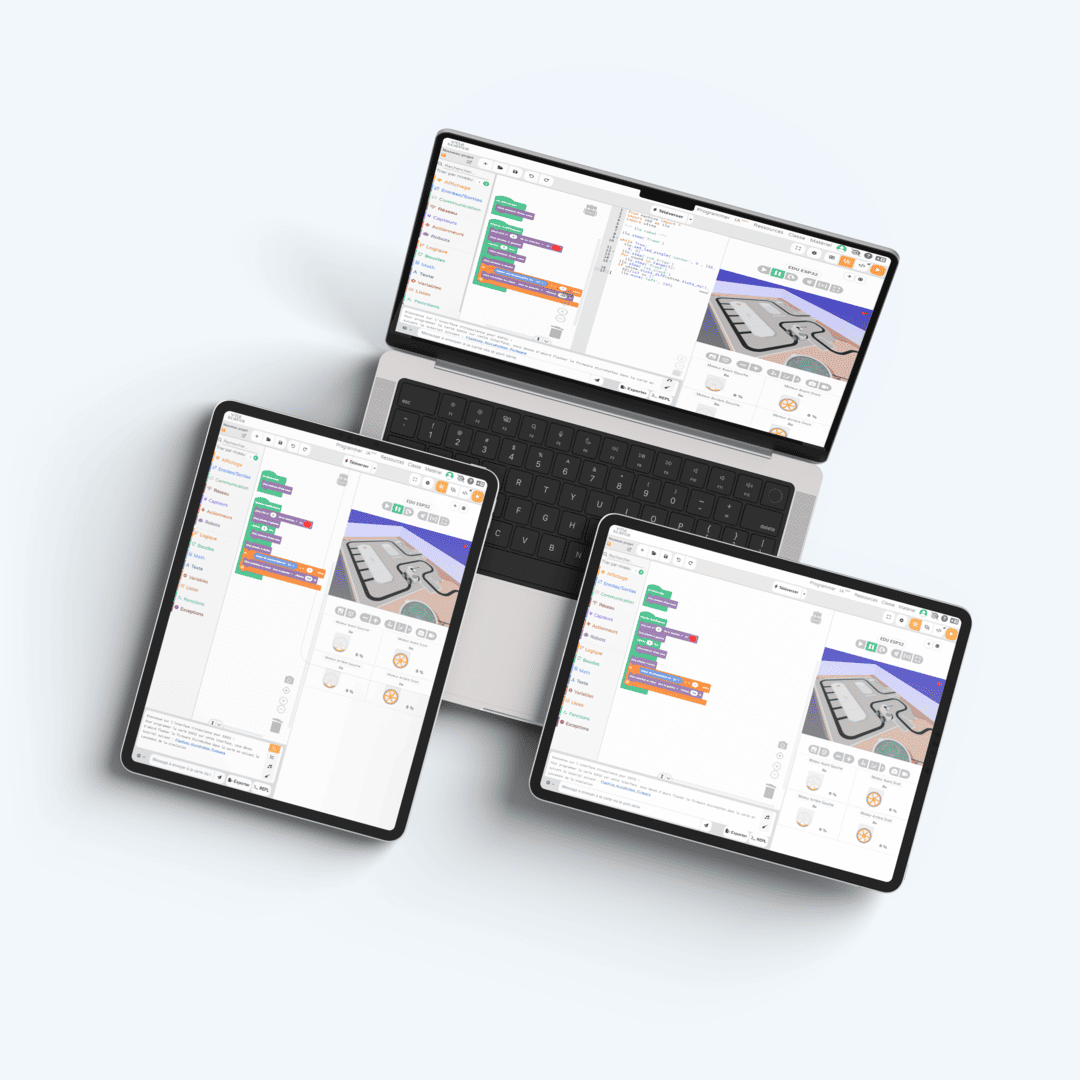 Un ordinateur portable, une tablette et un smartphone montrant une utilisation de la plateforme Vittascience pour programmer des robots ilo